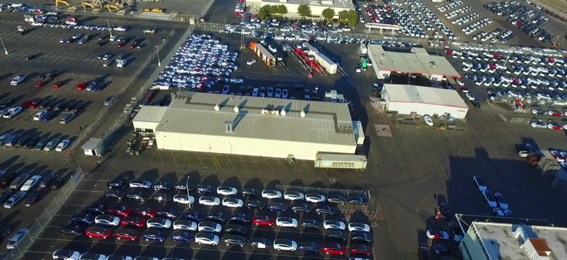 Beautiful new aerial look at Tesla Fremont – lots of cars ready to ship off