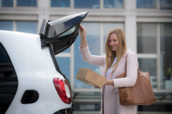 Daimler begins testing Smart car trunk delivery service with DHL